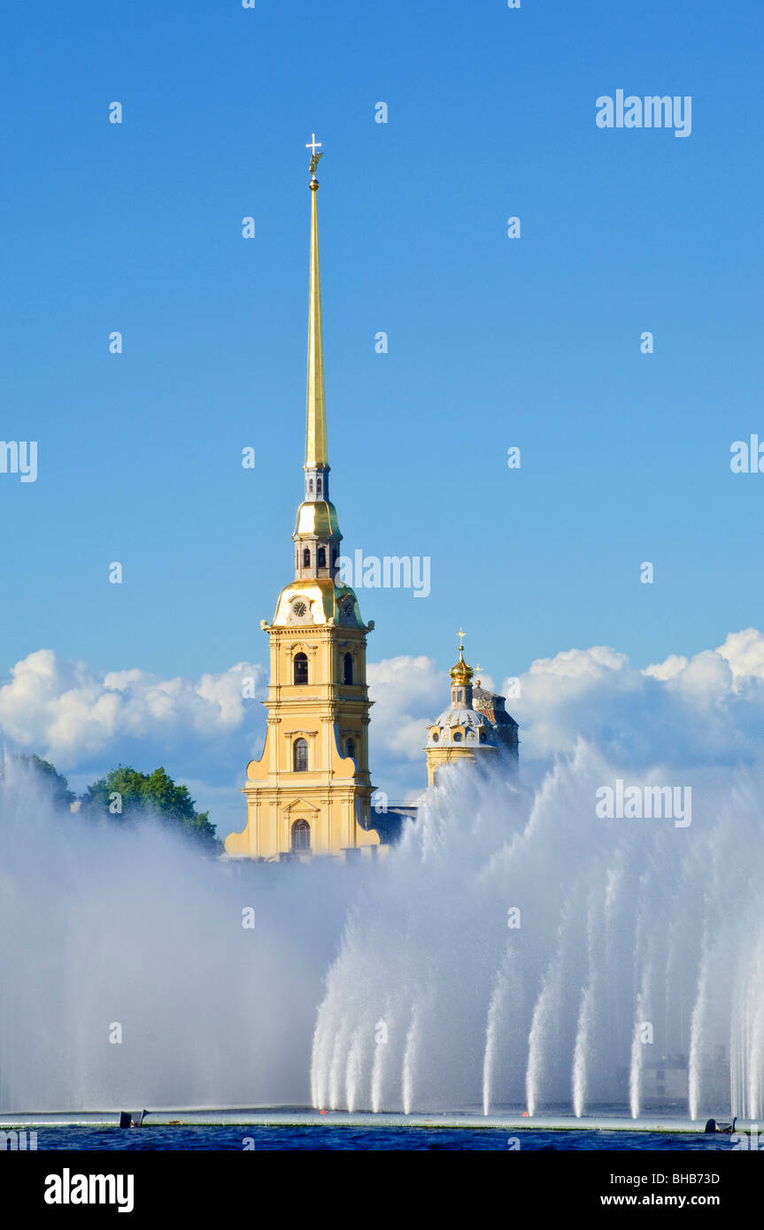The spire of SS Peter & Paul Cathedral rises above fountains in the River Neva, St Petersburg, Russia Stock Photo