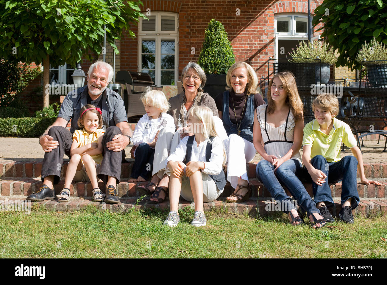 family in front of their home Stock Photo - Alamy
