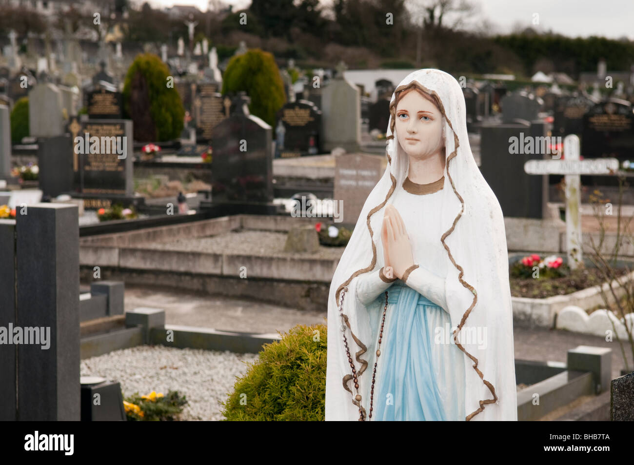 Statue of the Virgin Mary in a Catholic graveyard. Stock Photo