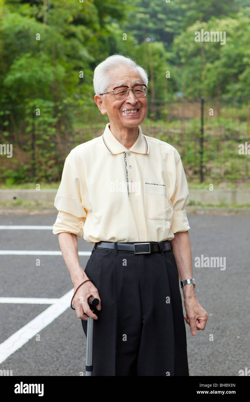 Man with walking stick hi-res stock photography and images - Alamy