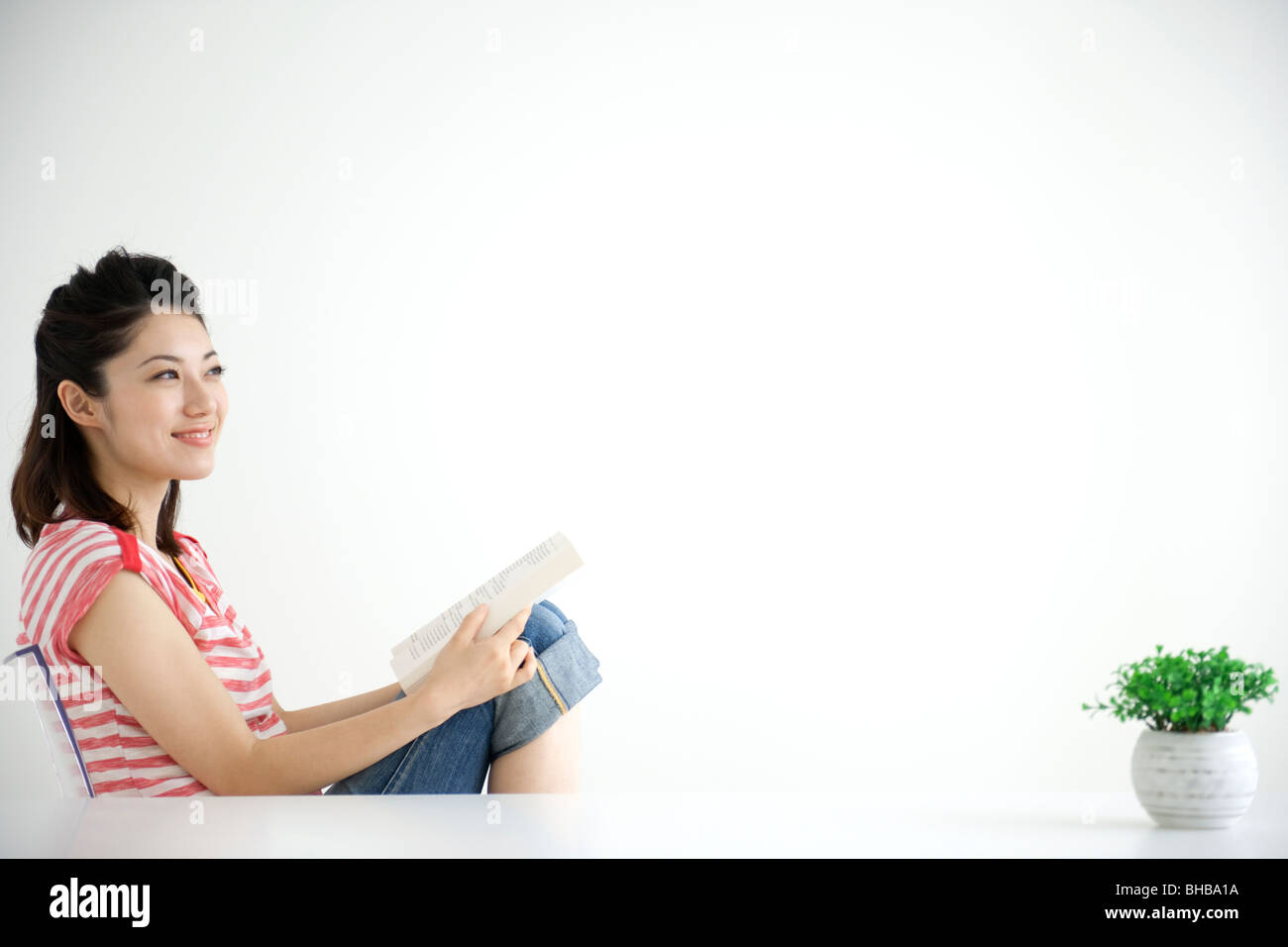 Young japanese woman on chair hi-res stock photography and images - Alamy