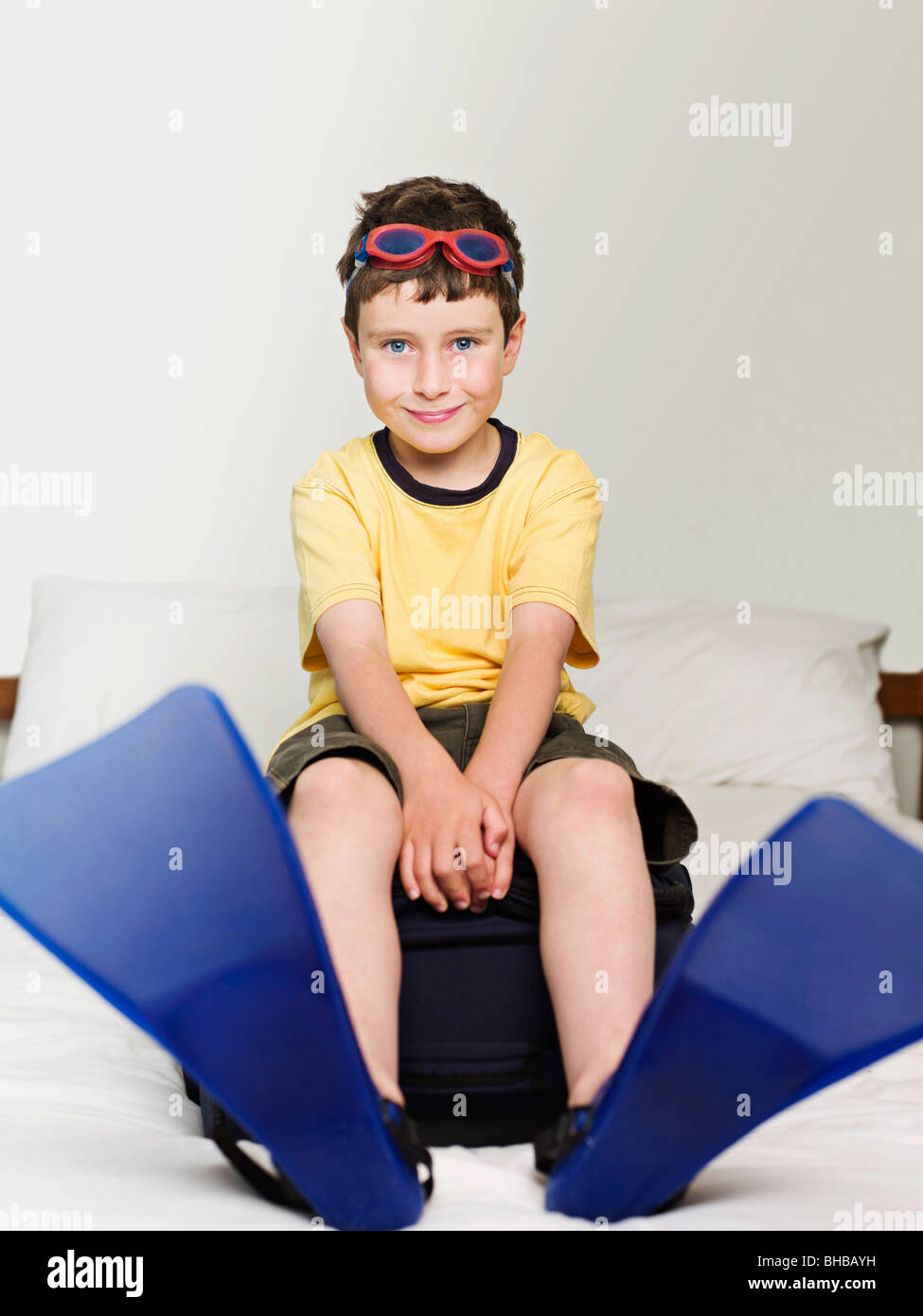 A boy wearing goggles and flippers Stock Photo Alamy