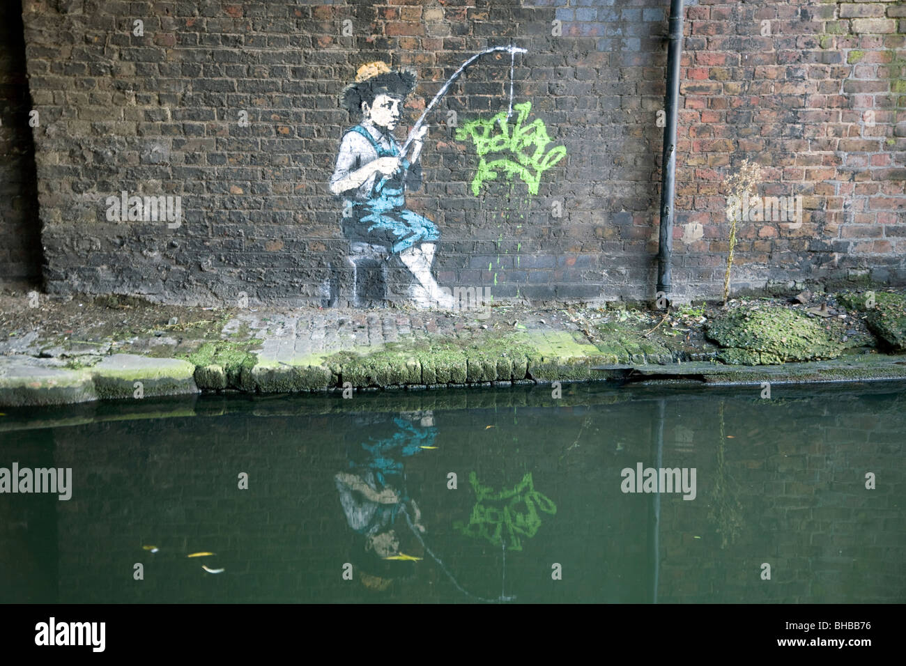 New graffiti in Camden Town, London either a Banksy or good forger. Stock Photo