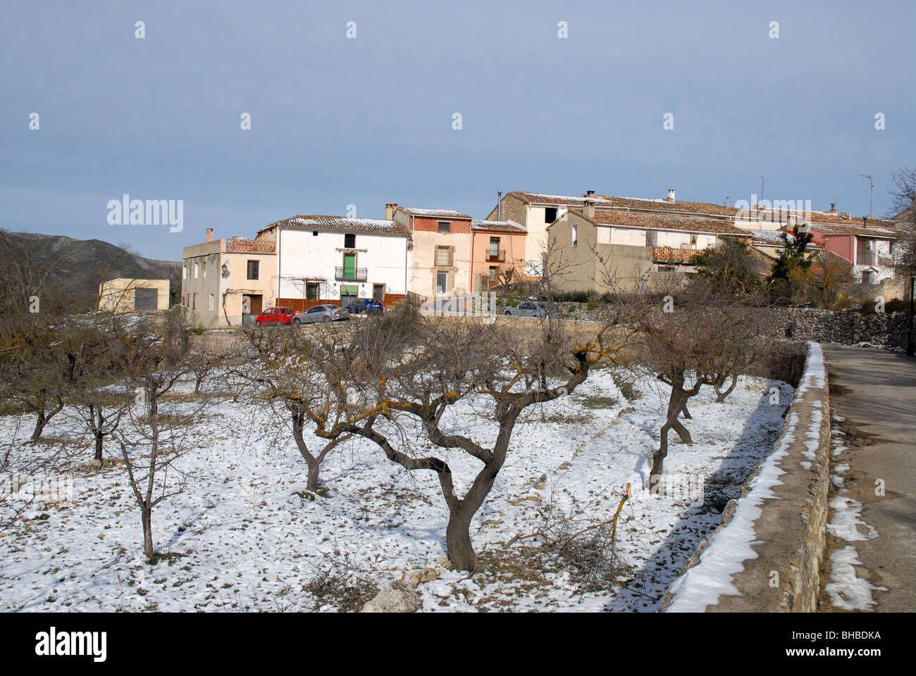 view to village of Beniaia / Beniaya in winter with snow, Vall de Alcala, Alicante Province, Comunidad Valenciana, Spain Stock Photo
