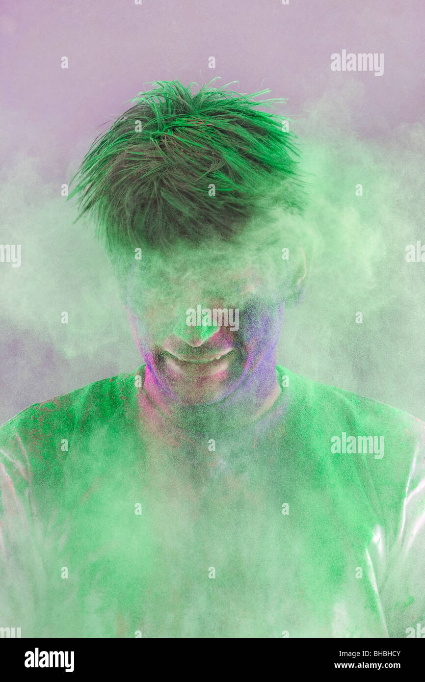 Man covered in holi colours Stock Photo
