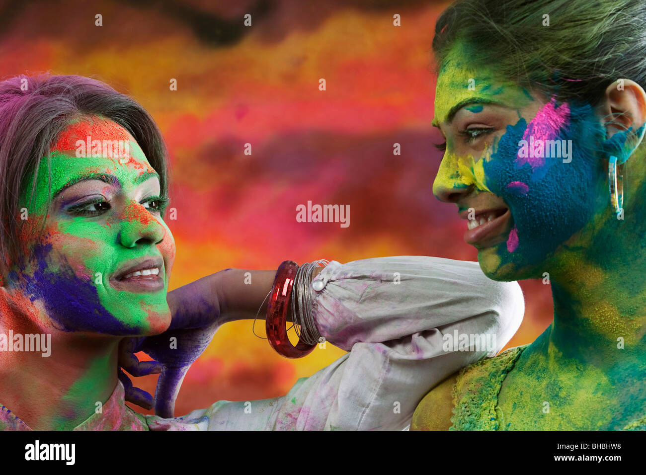 Women covered in holi colours Stock Photo