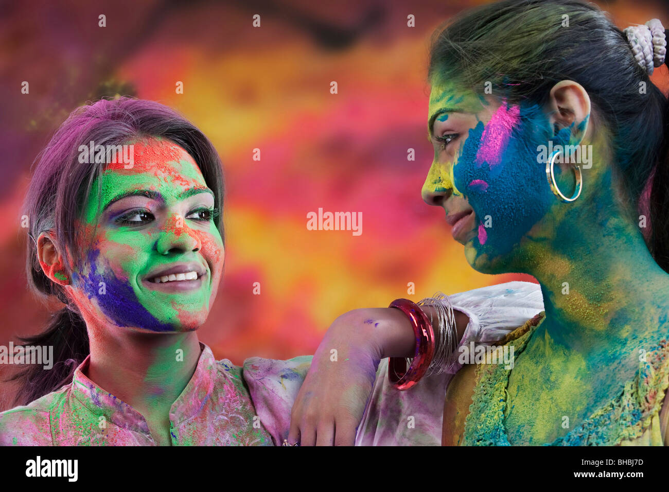 Women covered in holi colours Stock Photo