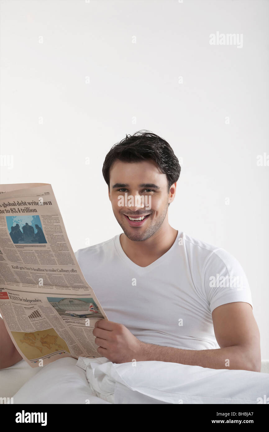 Man holding a newspaper Stock Photo - Alamy