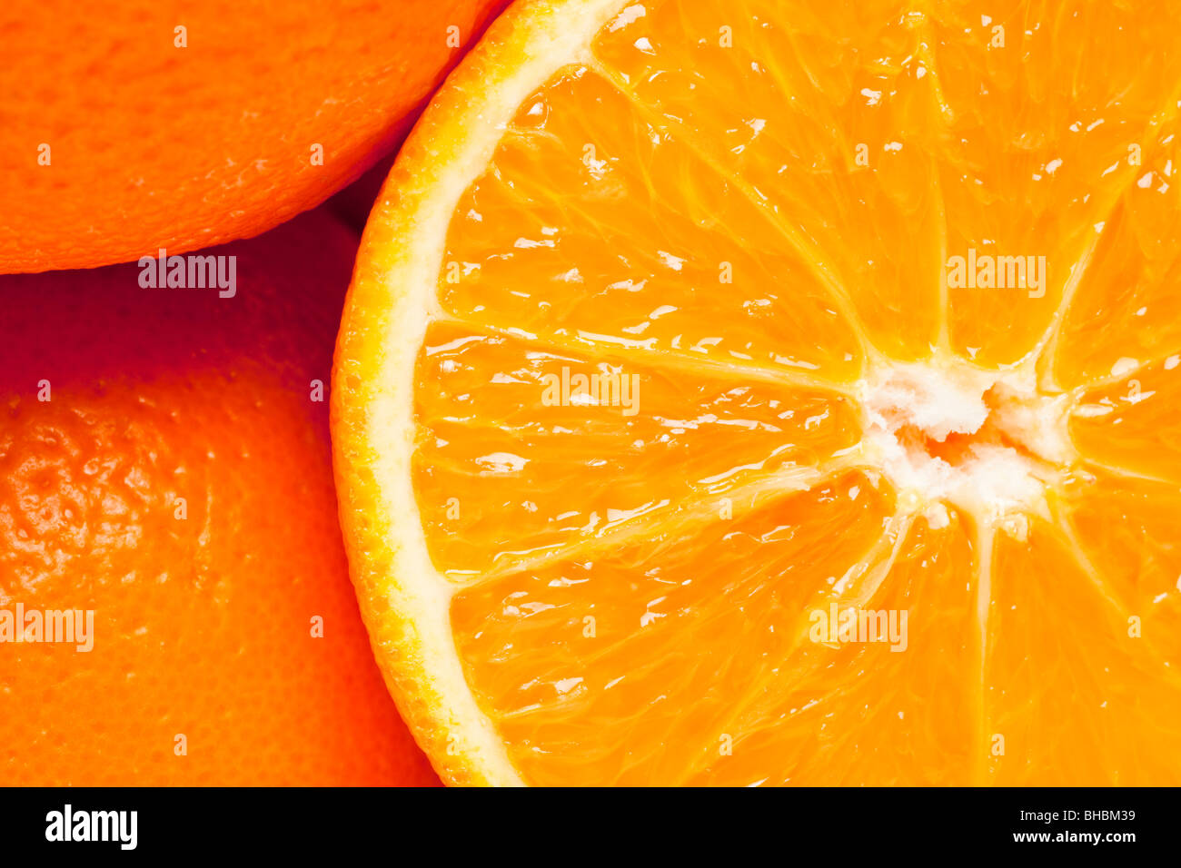 Flat lay overhead close up shot of oranges whole and halved Stock Photo