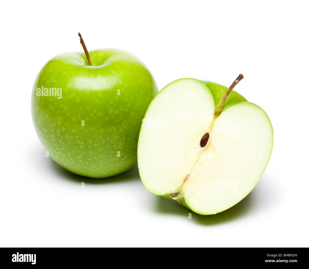 Green apples whole and halved Stock Photo
