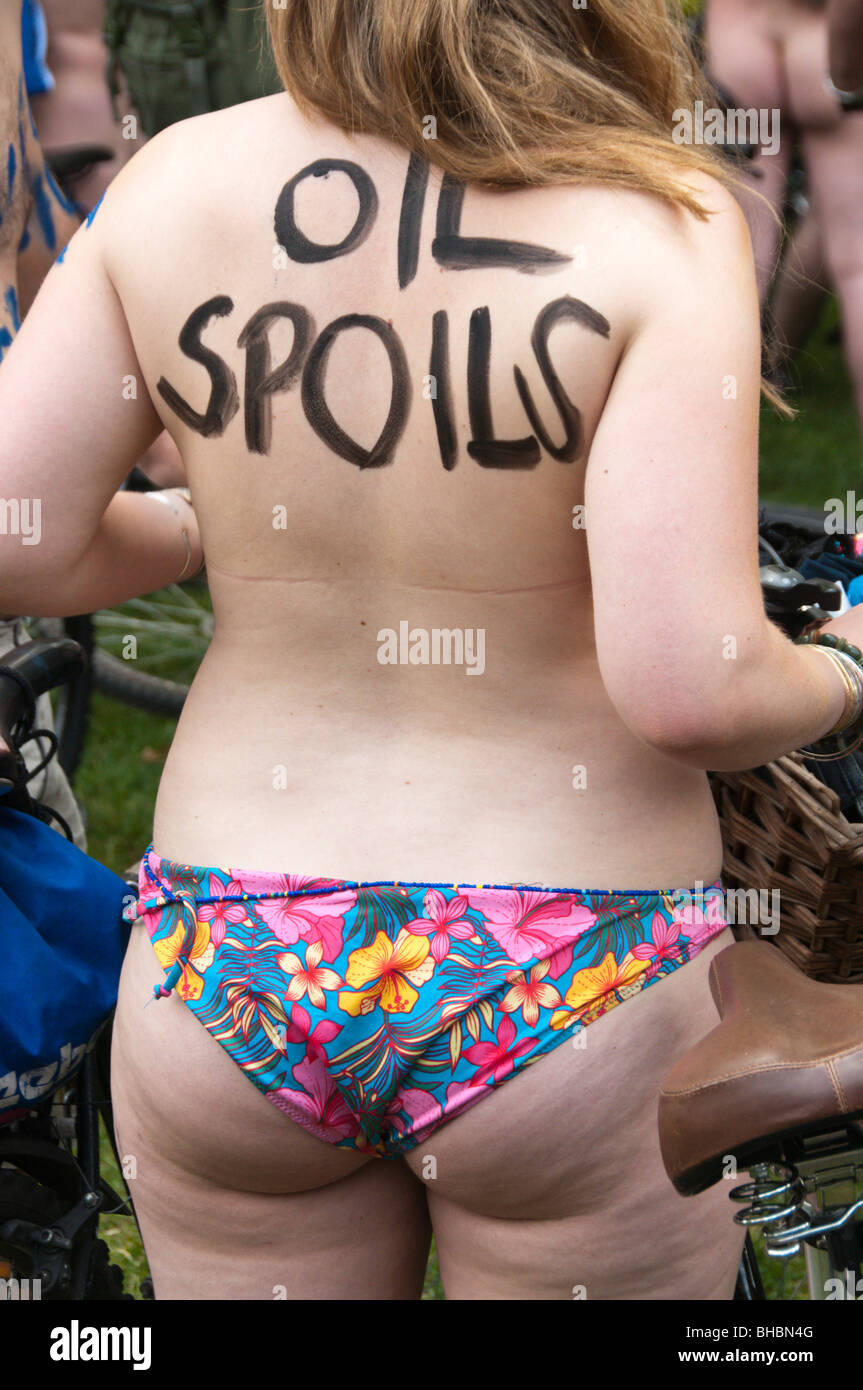 World Naked Bike RIde, London, 2009. Woman in flowery bikini bottom with 'Oil Spoils' on her Photo - Alamy