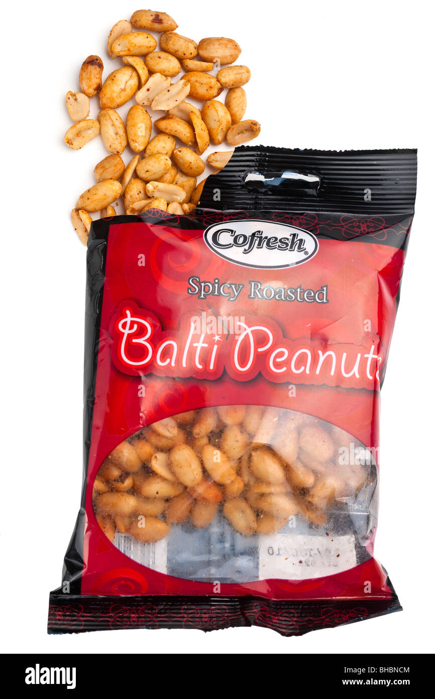Bag of Cofresh spicy roasted Balti peanuts spilling onto a white surface Stock Photo