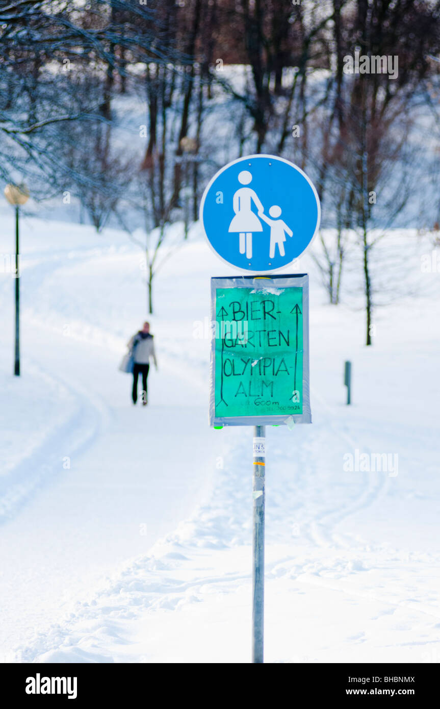 Path to where the beer is ice cold!  Sign showing the way to the beer garden at Munich's Olympic park in Germany. Stock Photo