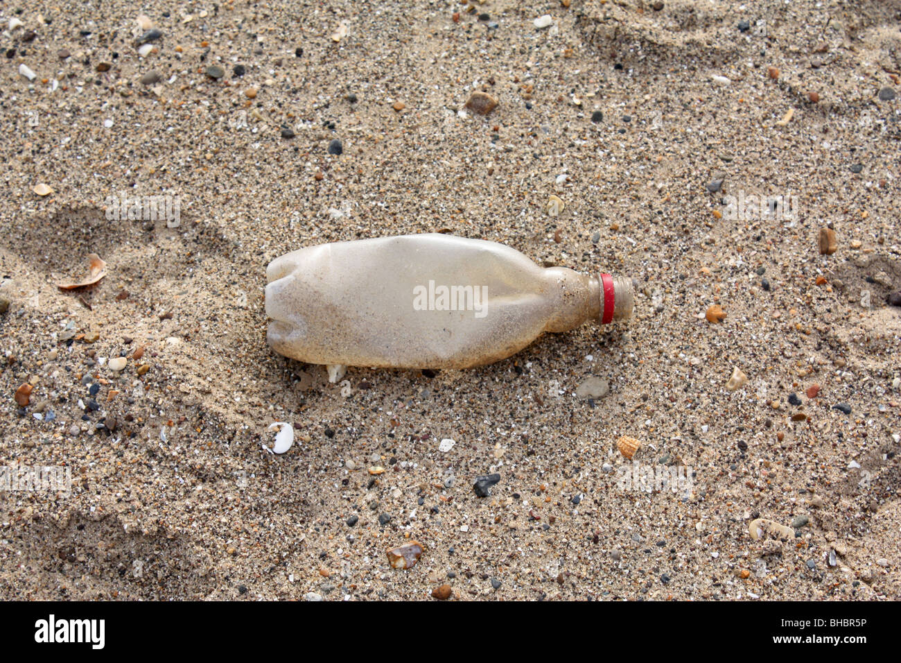 Discarded plastic bottle on a beach Stock Photo