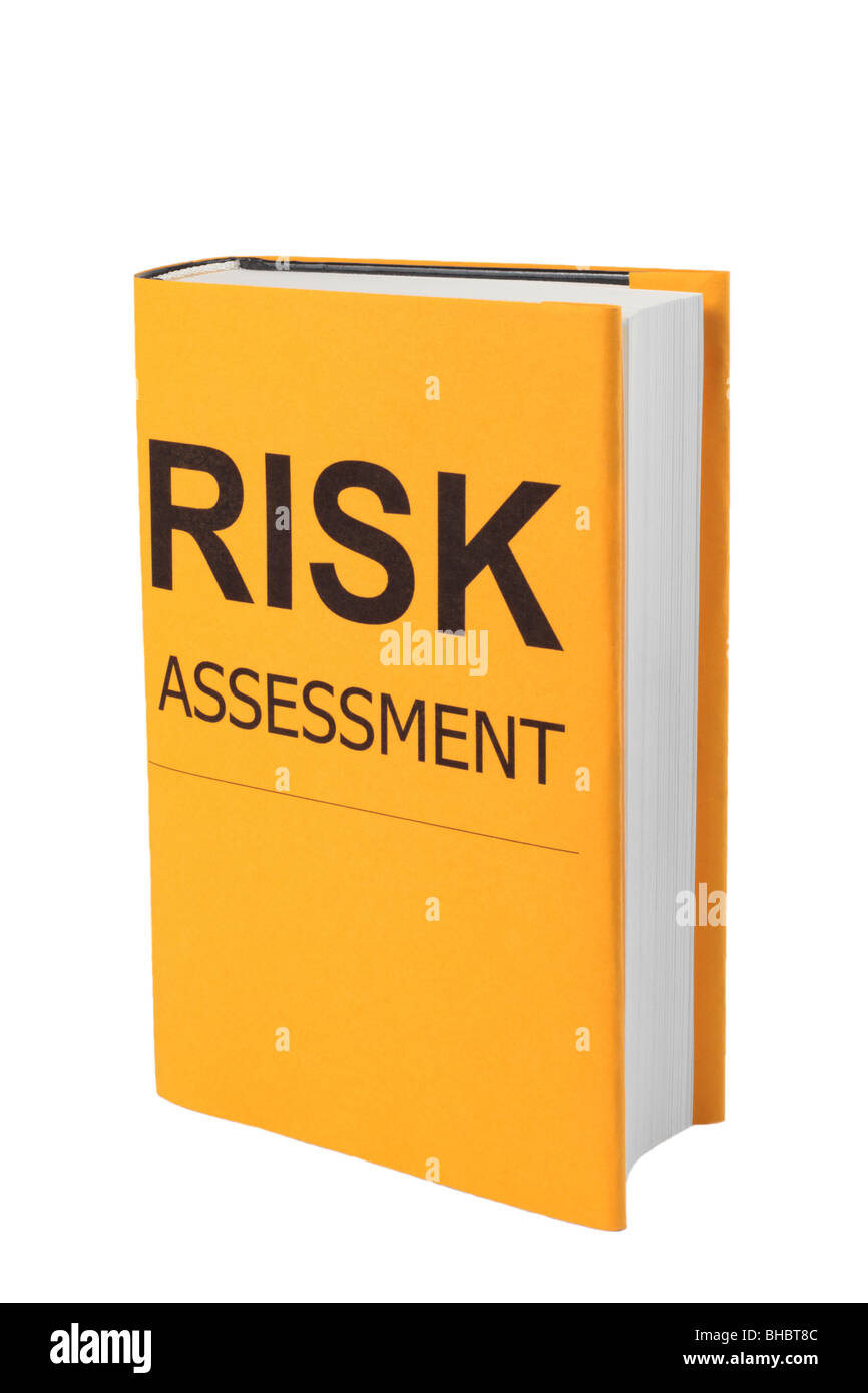 Book with words Risk Assessment on orange cover Stock Photo
