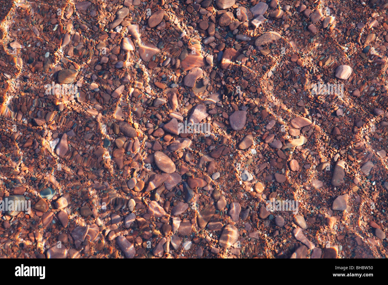 View from above the water surface to rocks on the bottom of Lake Superior. Stock Photo