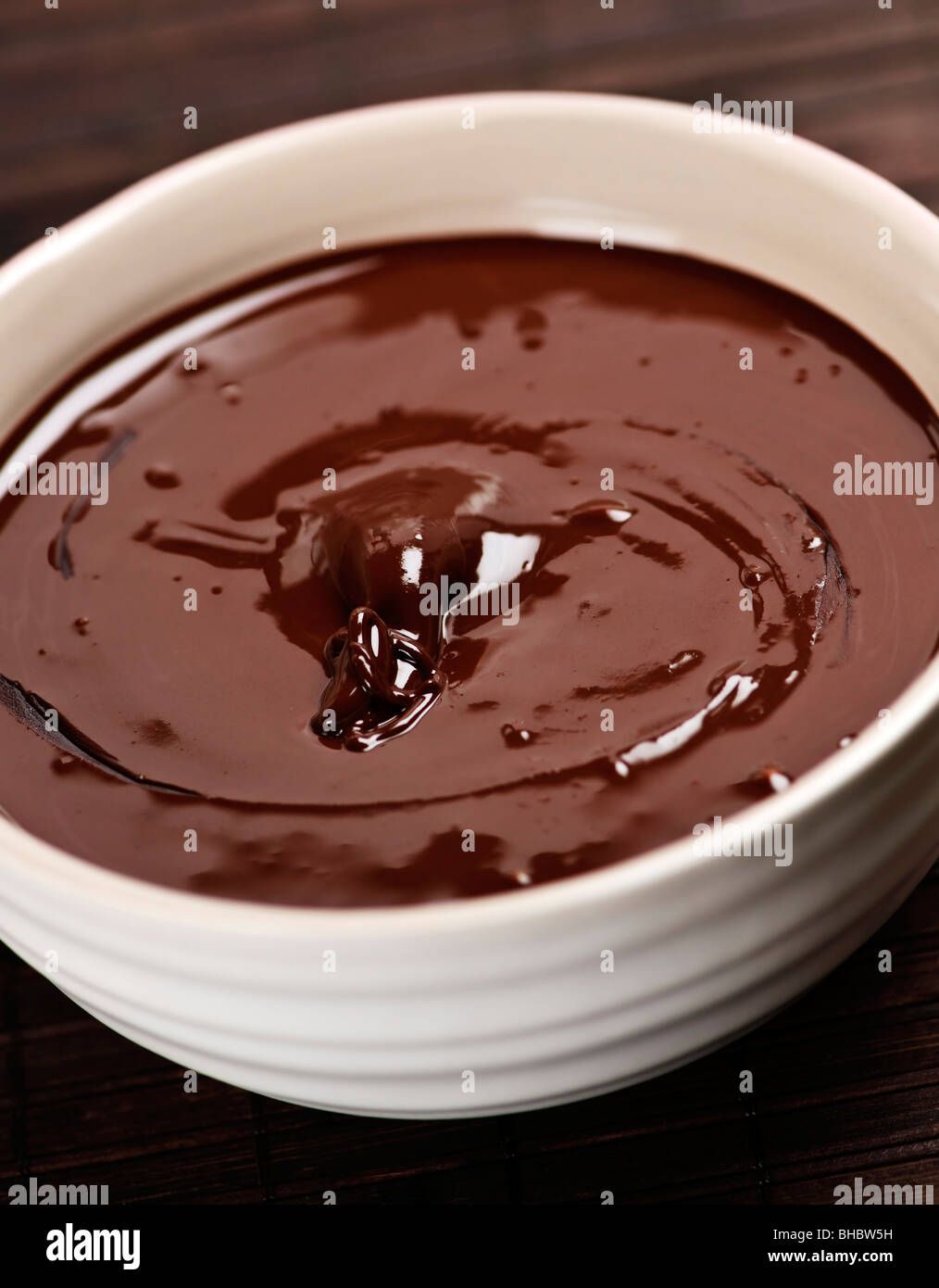 Bowl of soft melted rich dark chocolate Stock Photo