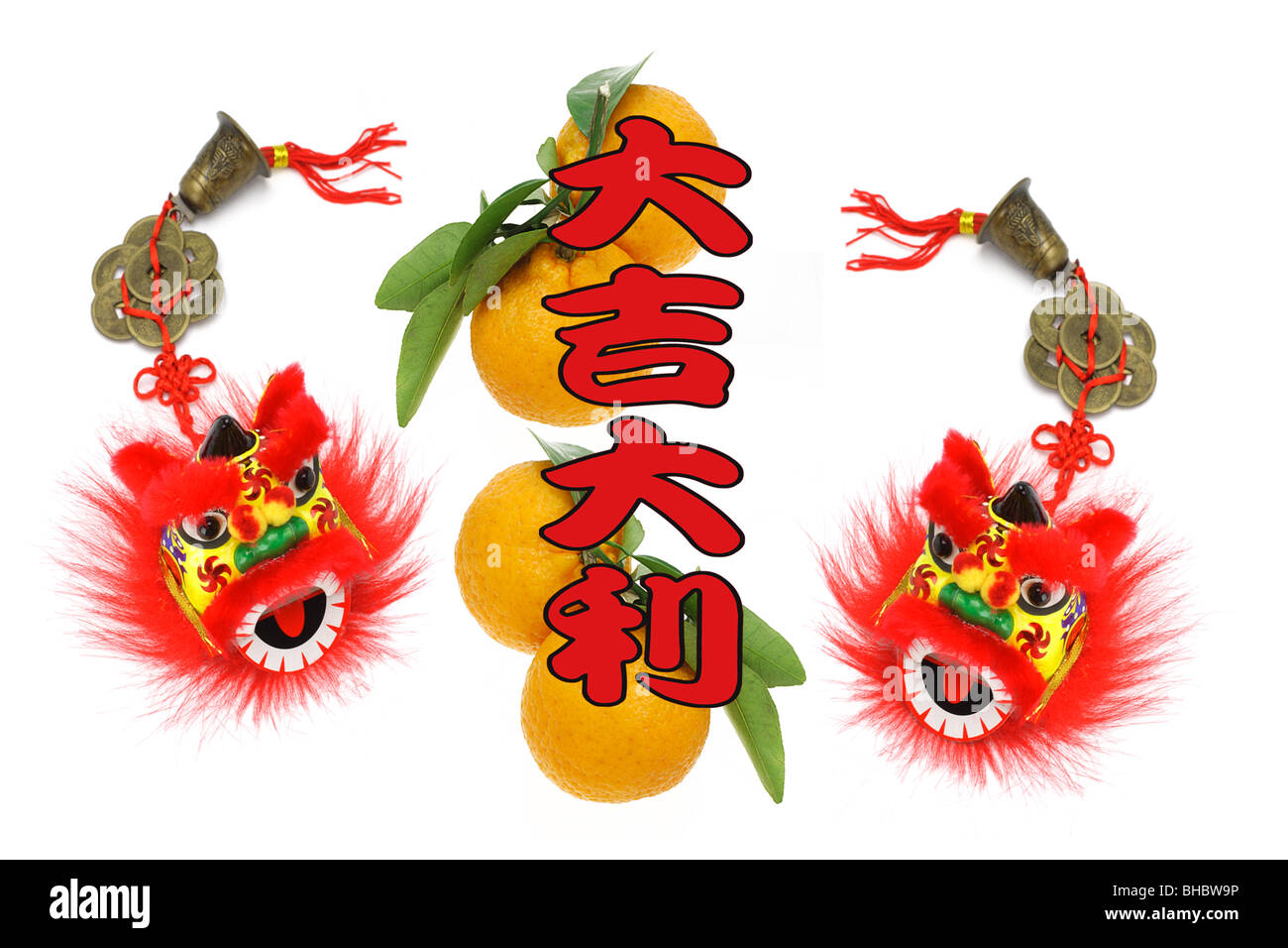 Chinese lunar new year greetings with lion head ornaments and oranges Stock Photo