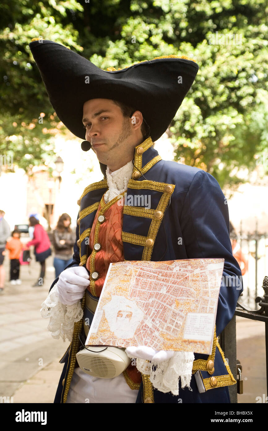 A tour guide wearing eighteenth century costume shows a map of the historic  city of San Cristobal de La Laguna, Tenerife Stock Photo - Alamy