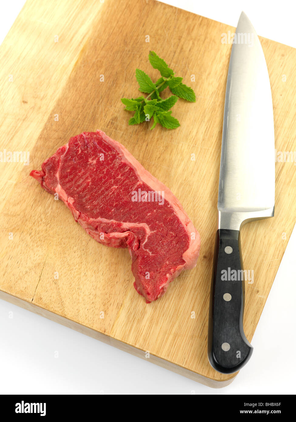 Porterhouse steak on a chopping board isolated against a white