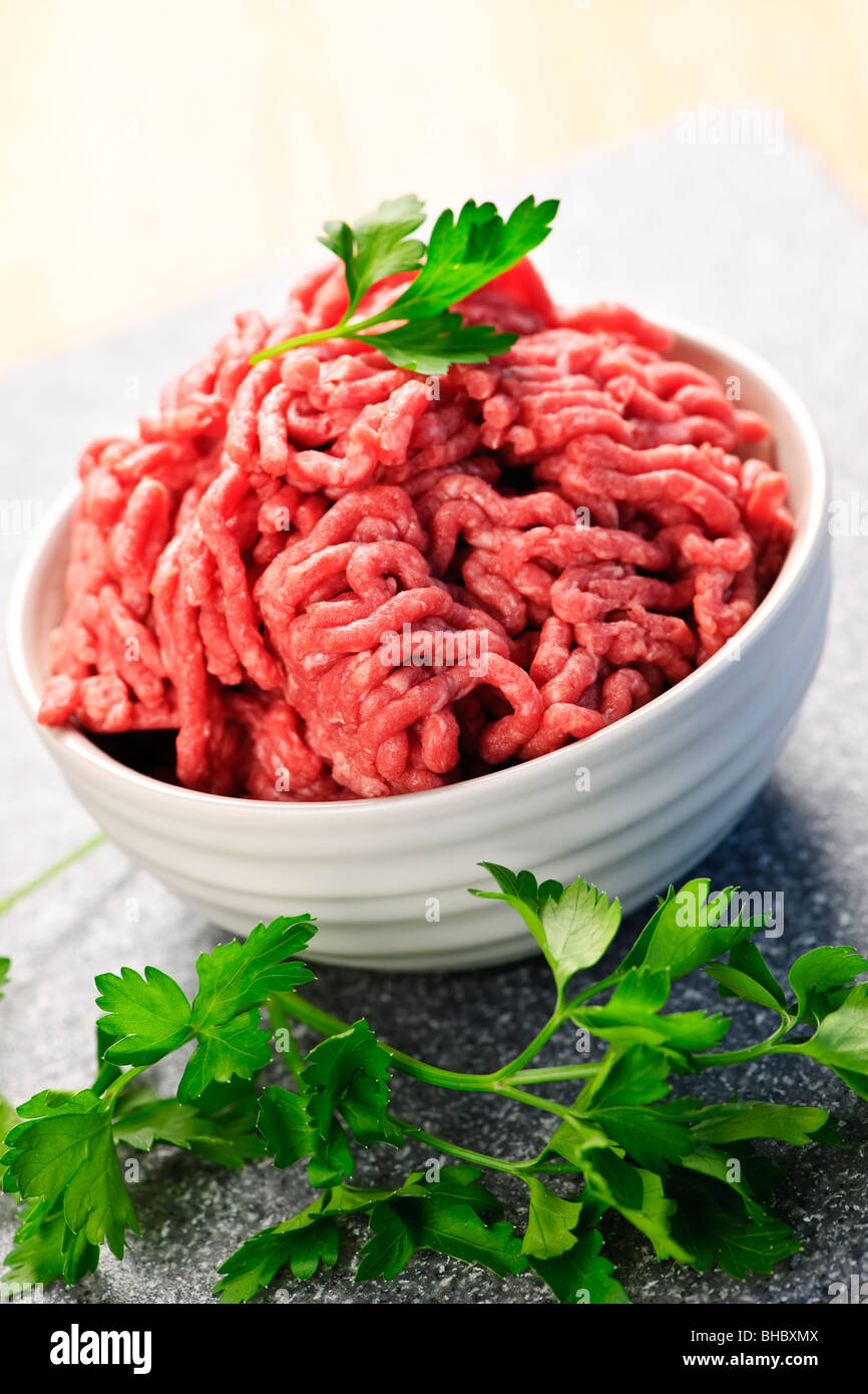 Close up on bowl of lean red raw ground meat Stock Photo