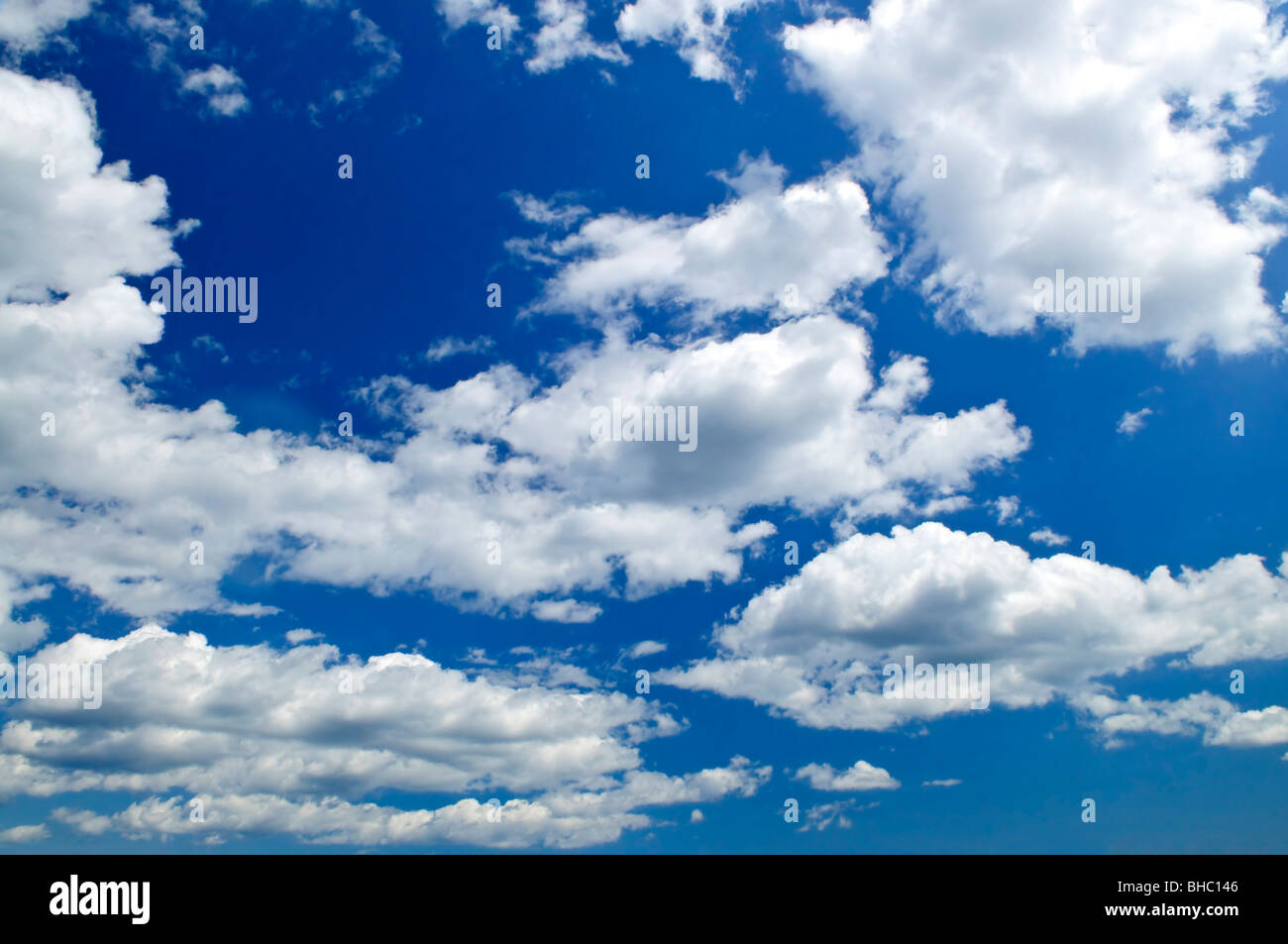 Background of blue sky with white cumulus clouds Stock Photo - Alamy