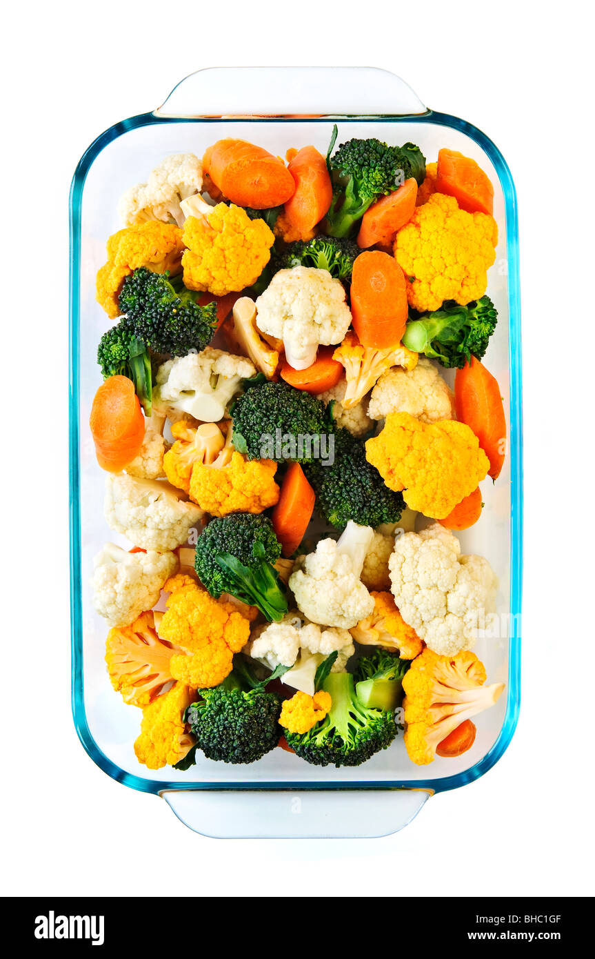 Raw cut vegetables in glass roasting pan Stock Photo