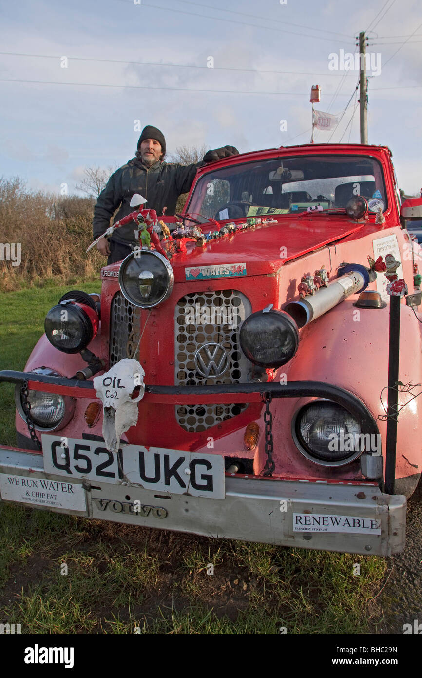Pink ecological car made of various makers parts, running on Vegetable oil fuel economy and