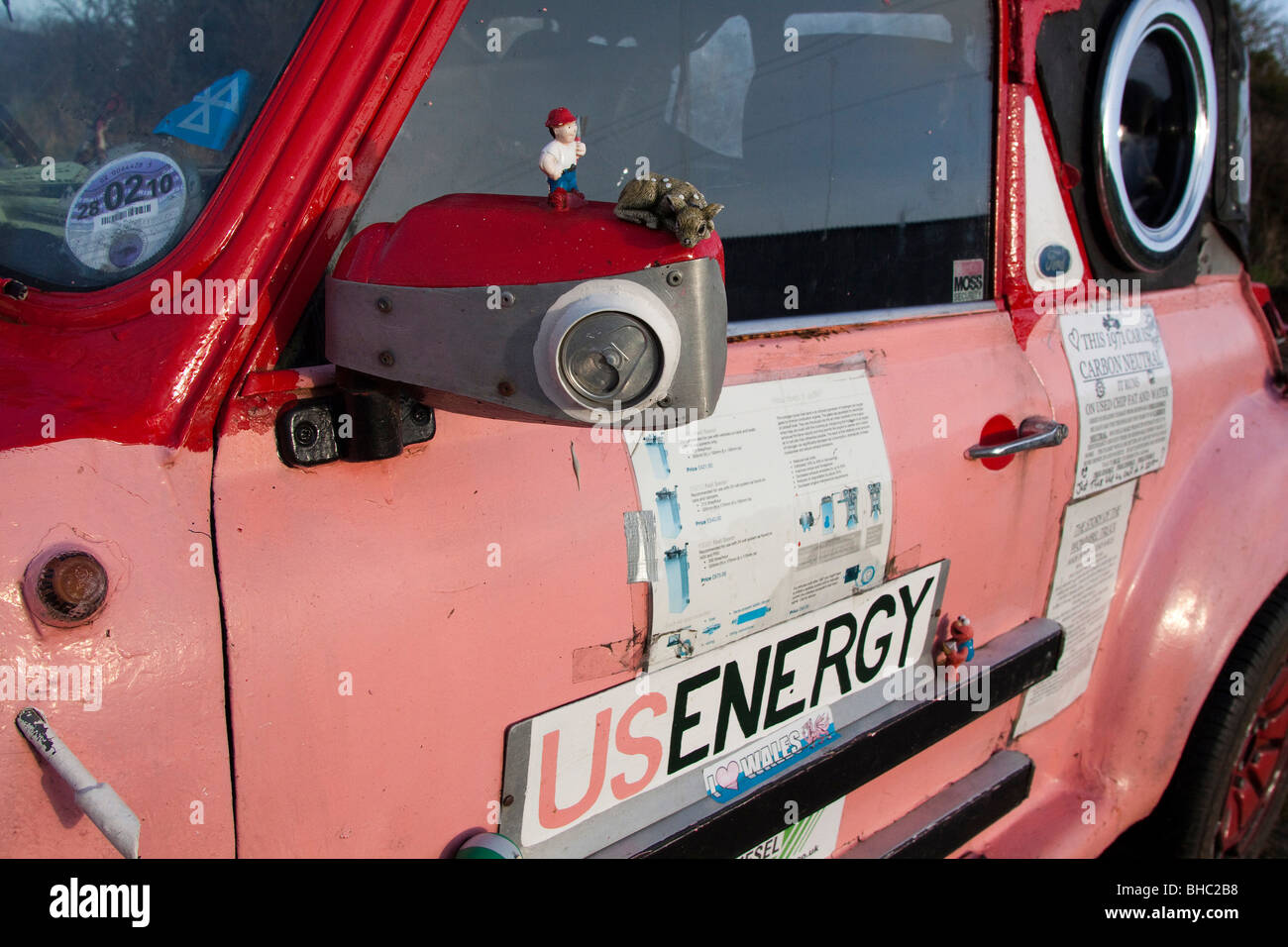 Pink ecological car made of various makers parts, running on Vegetable oil fuel economy and