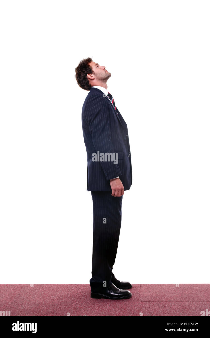 Full length shot of a businessman looking up high. Stock Photo