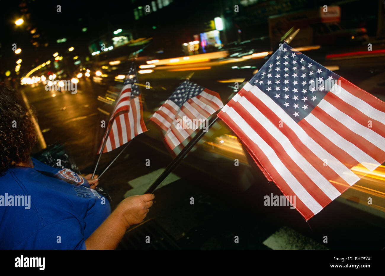 American flags re on sale at night in the streets of Manhattan, only days after the attacks on New York’s twin towers Stock Photo