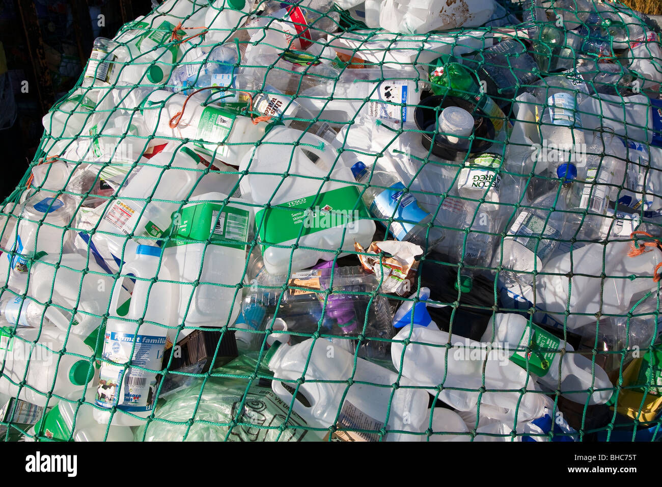 Plastic waste for recycling at recycling collection station in car park UK Stock Photo