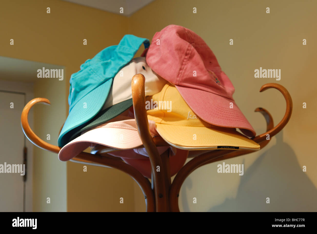 Hat Stand Colourful Hats and Coats Stock Photo Alamy