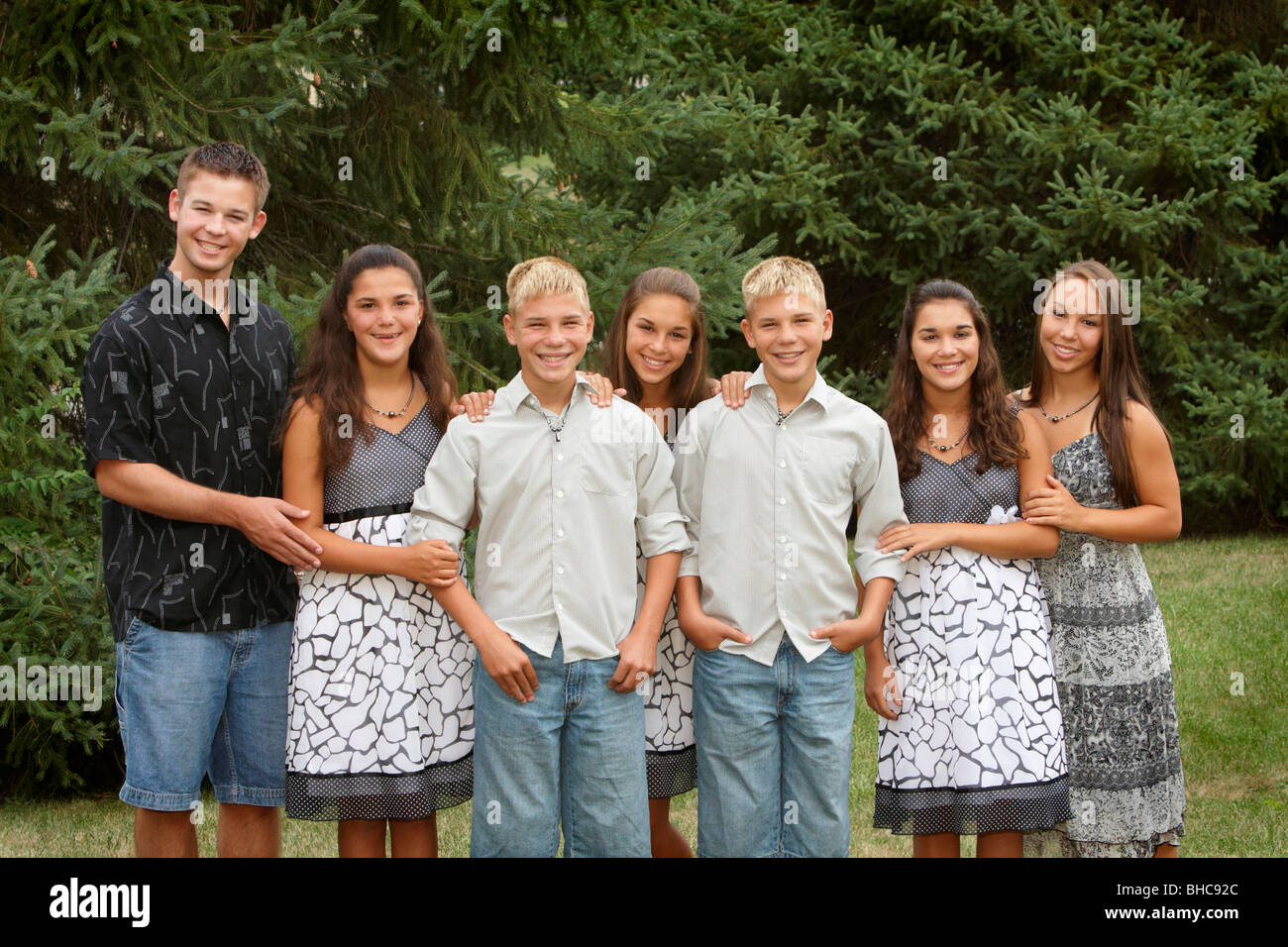 Seven children from the same family with twins and triplets Stock Photo