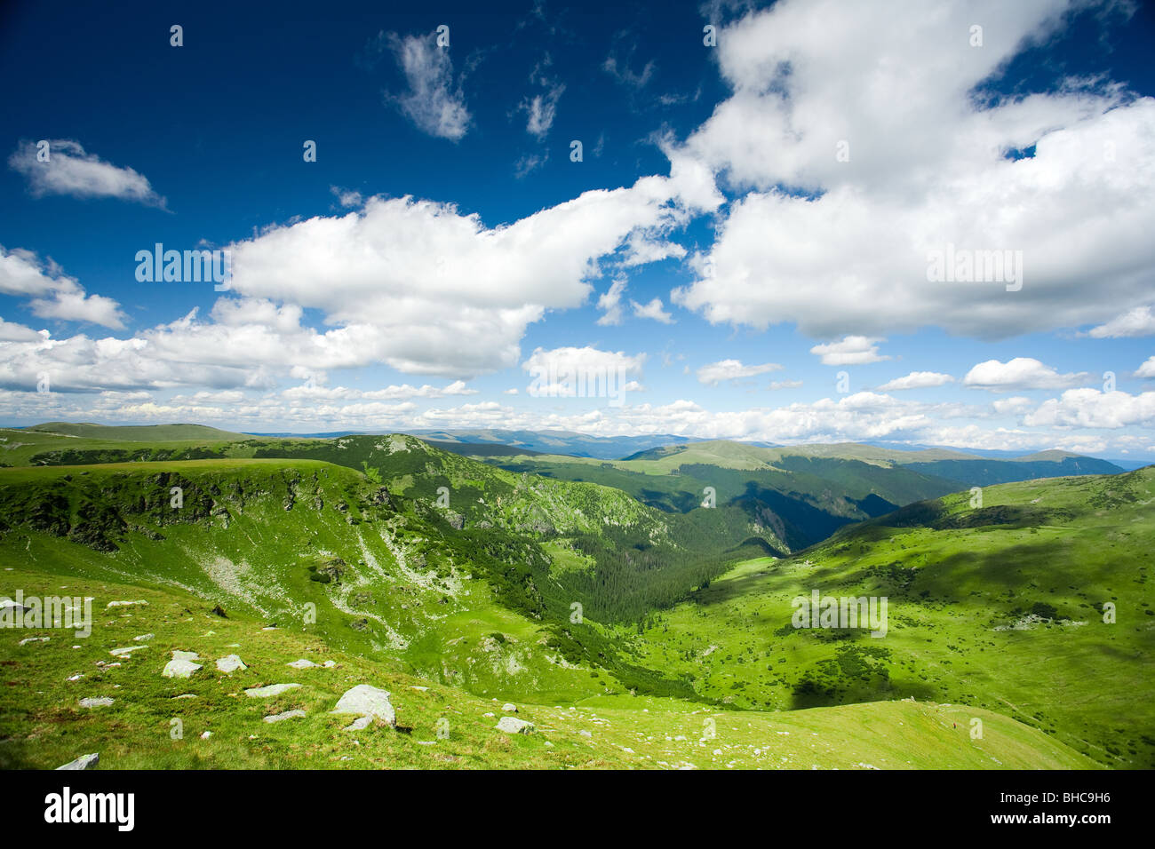 Beautiful landscape with mountains and fluffy clouds in the sky Stock ...
