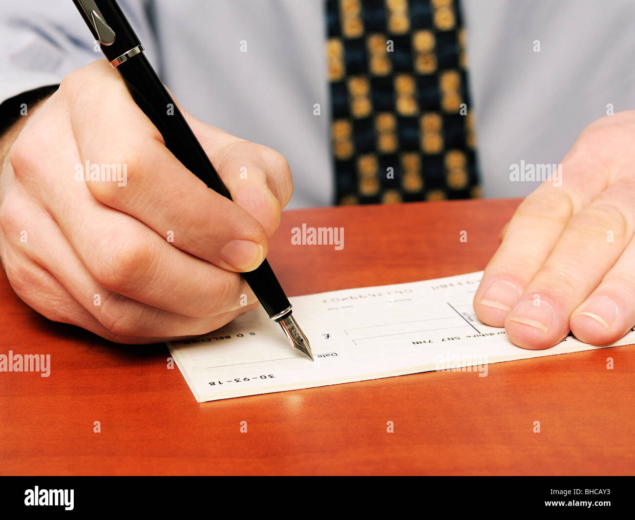 Writing a Cheque Stock Photo