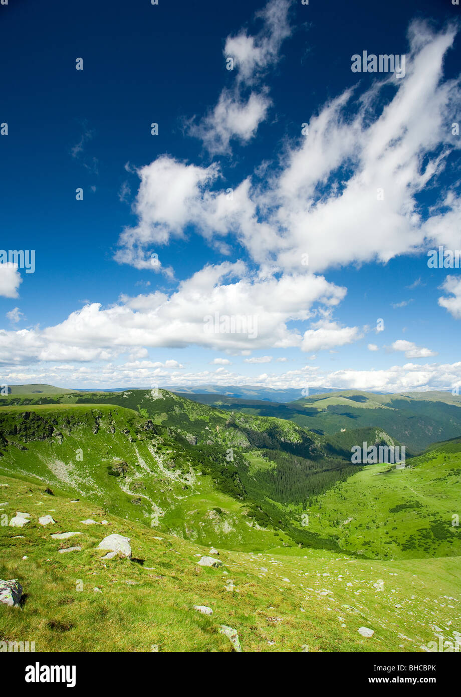 Beautiful landscape with mountains and fluffy clouds in the sky Stock ...