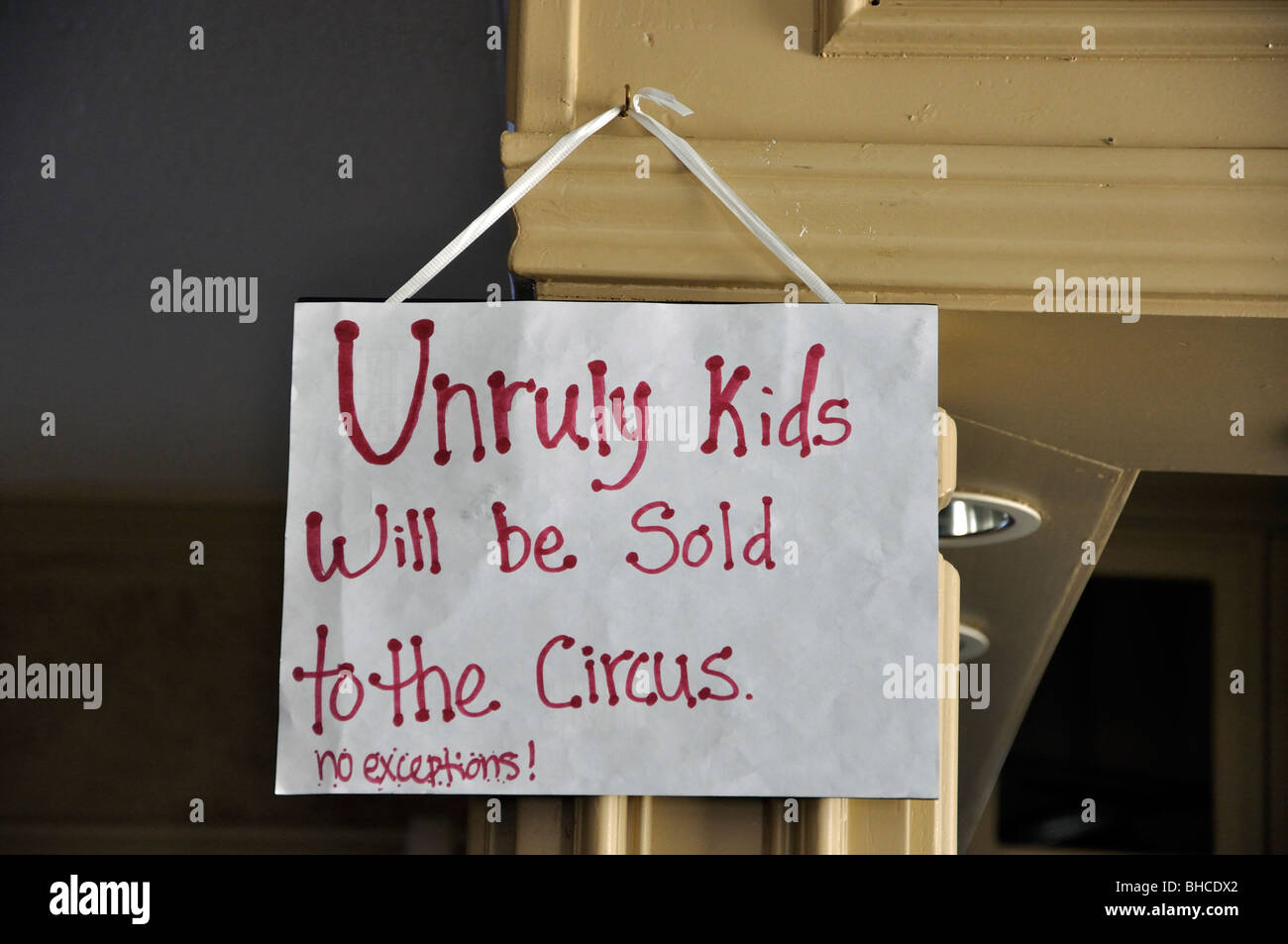 Note in museum saying 'Unruly kids will be sold to the circus. No exceptions.' Stock Photo