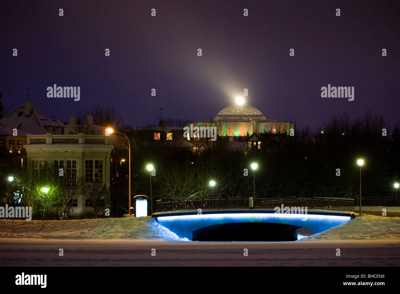 Perlan restaurant as seen from Tjornin lake. Downtown Reykjavik Iceland Stock Photo