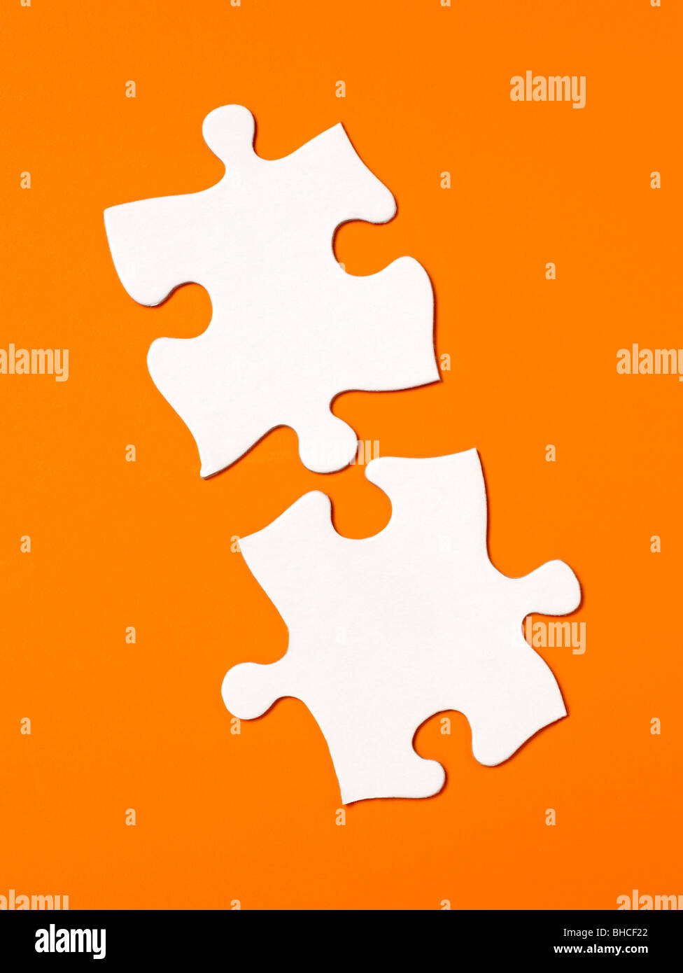 Orange white Puzzle pieces elevated view Stock Photo