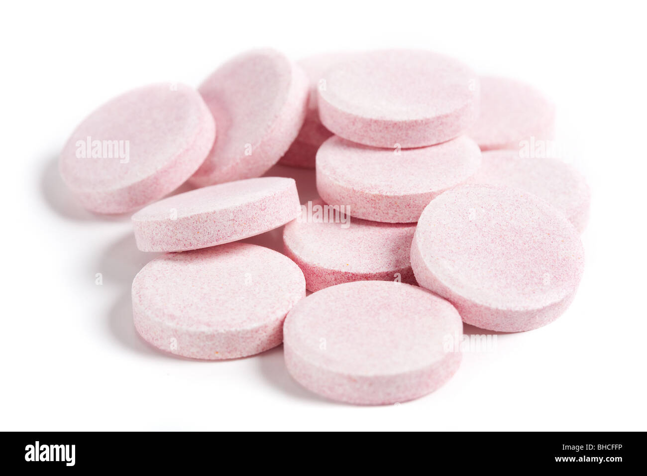 Close up of a pile of vitamins isolated on white background Stock Photo ...