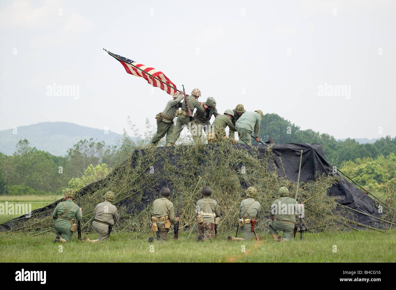 A World War II reenactment of US Marines raising the American flag on Iwo Jima on February 23, 1945 at Mid-Atlantic Air Museum Stock Photo