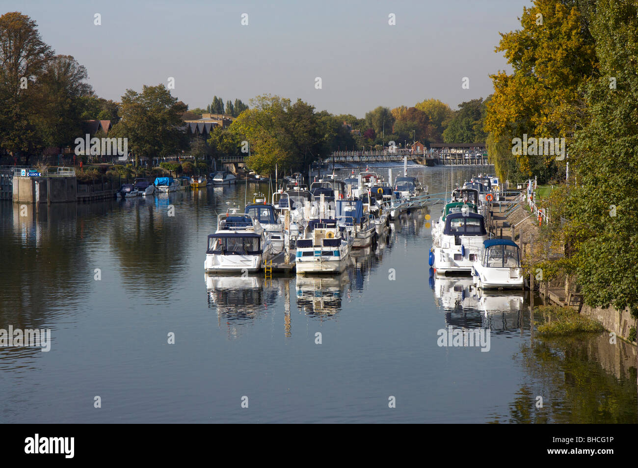 Moored boats and lock on the River Thames at Hampton Court, Surrey