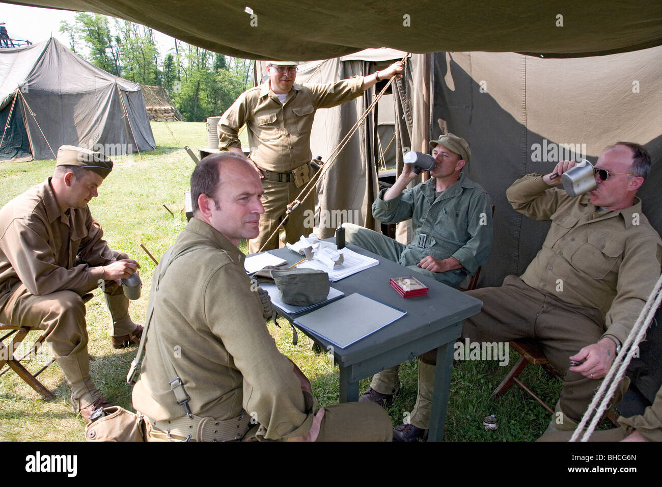 Soldiers relax in front of tent, at Mid-Atlantic Air Museum World War II Weekend and Reenactment in Reading, PA Stock Photo