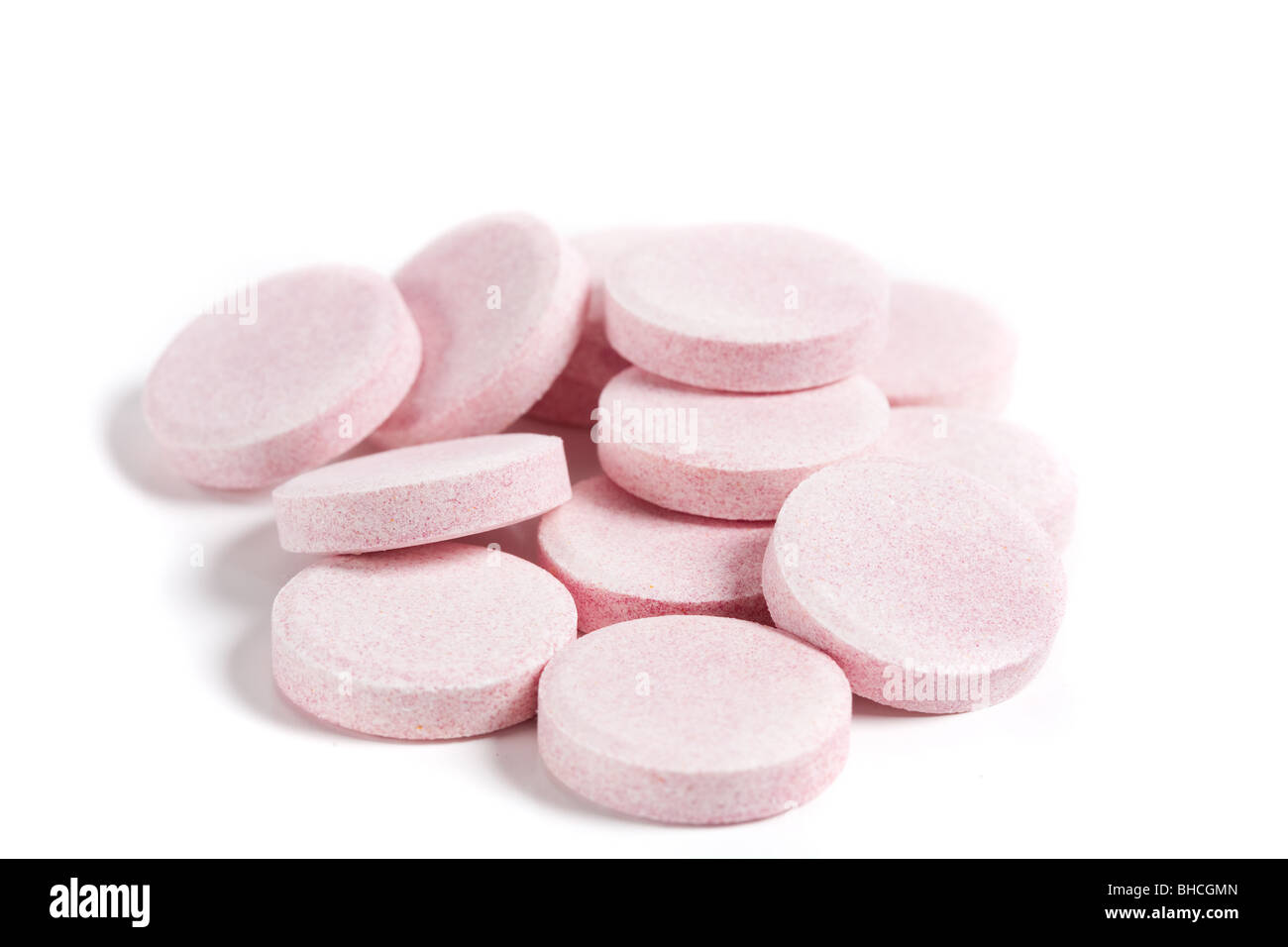 Close up of a pile of vitamins isolated on white background Stock Photo ...