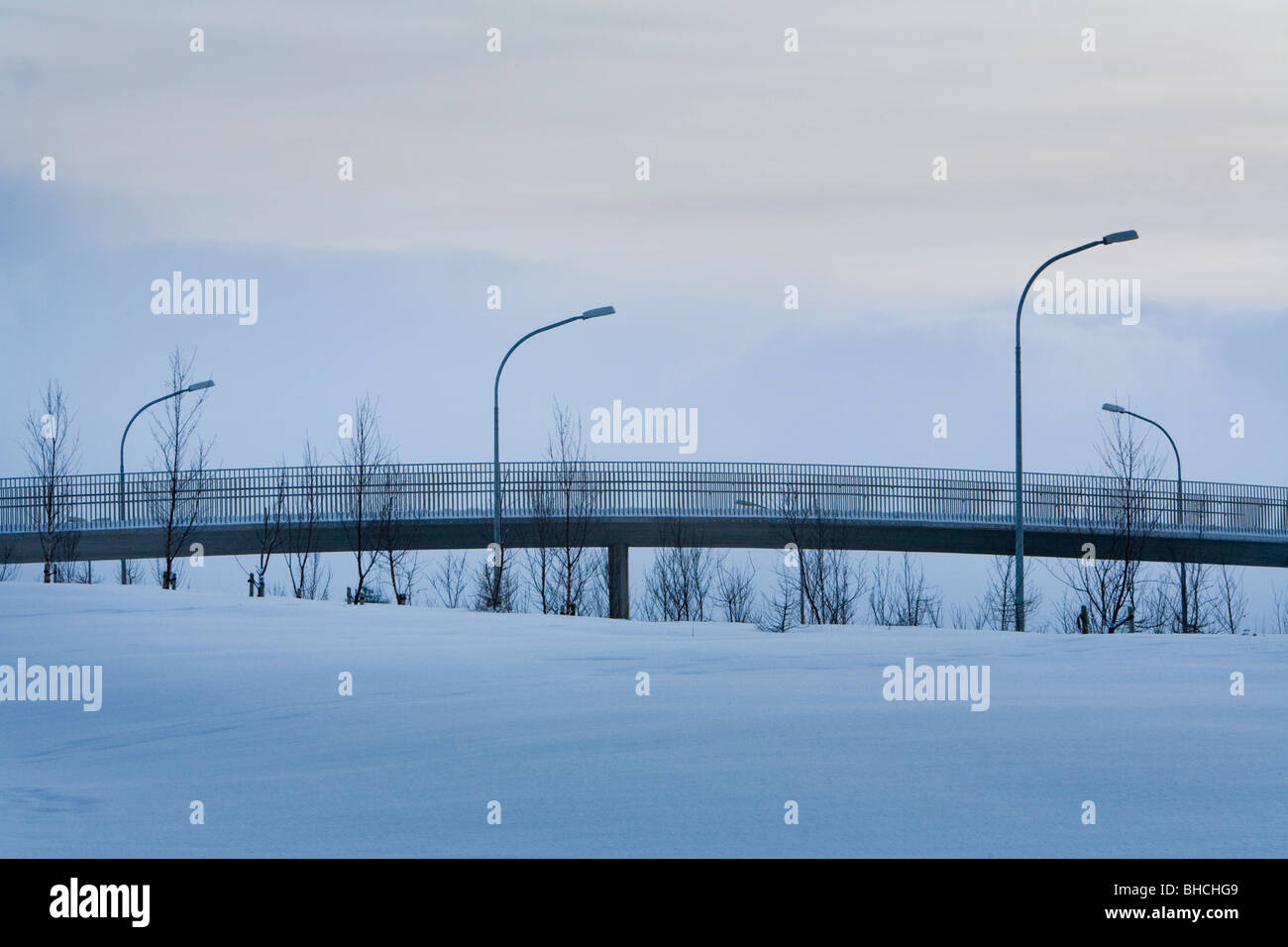 Lampposts and a footbridge during winter. Reykjavik Iceland Stock Photo