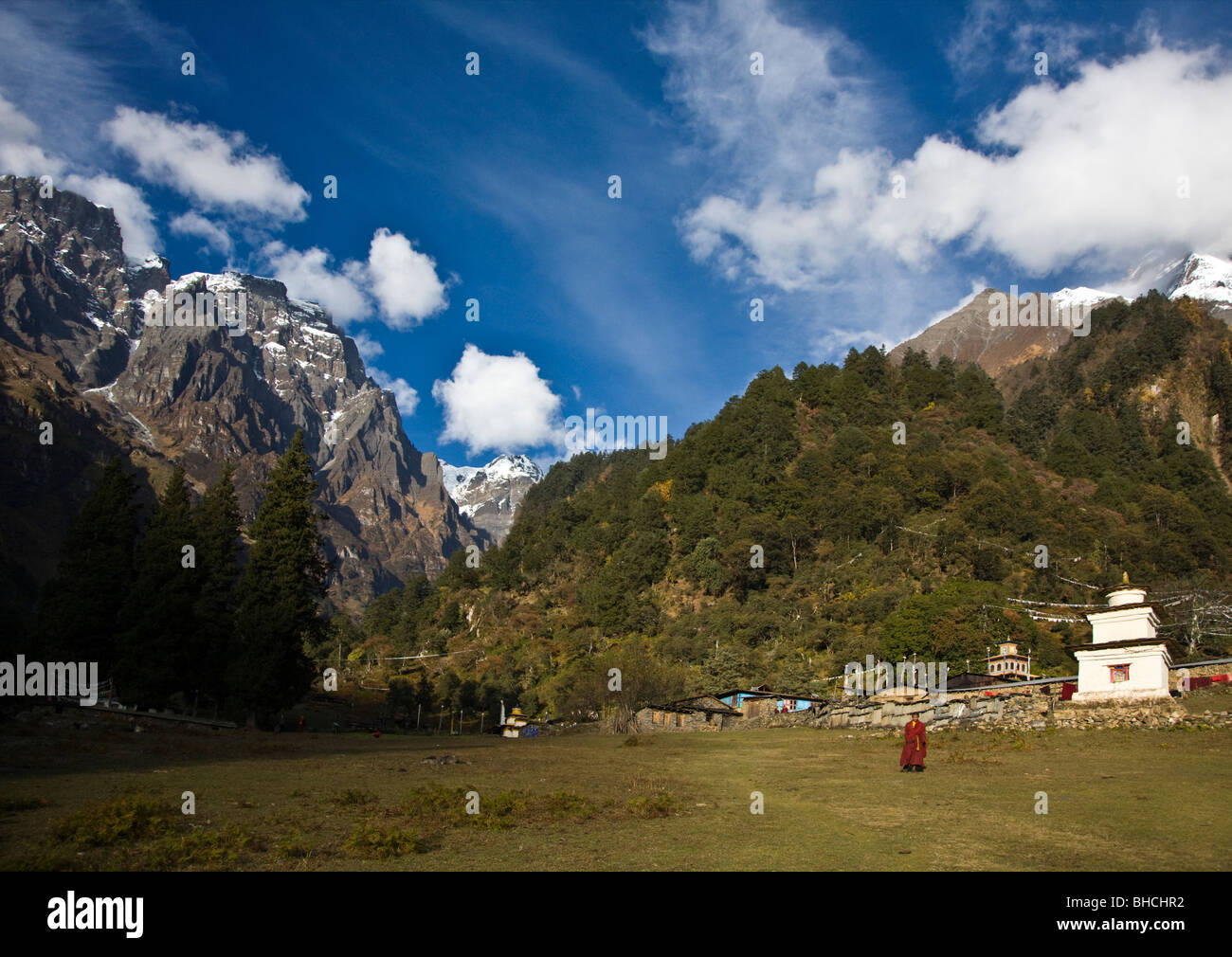 A NUN greets us an we enter a remote TIBETAN BUDDHIST MONASTERY - NEPAL HIMALALA Stock Photo