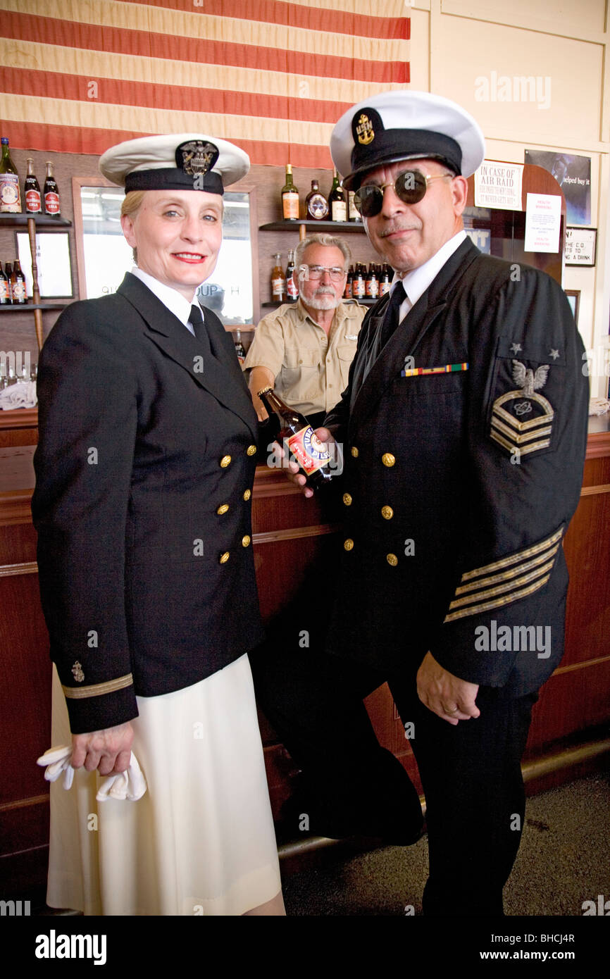 1940s Navy officers in a vintage World War II-style bar at the Mid-Atlantic Air Museum World War II Weekend and Reenactment Stock Photo