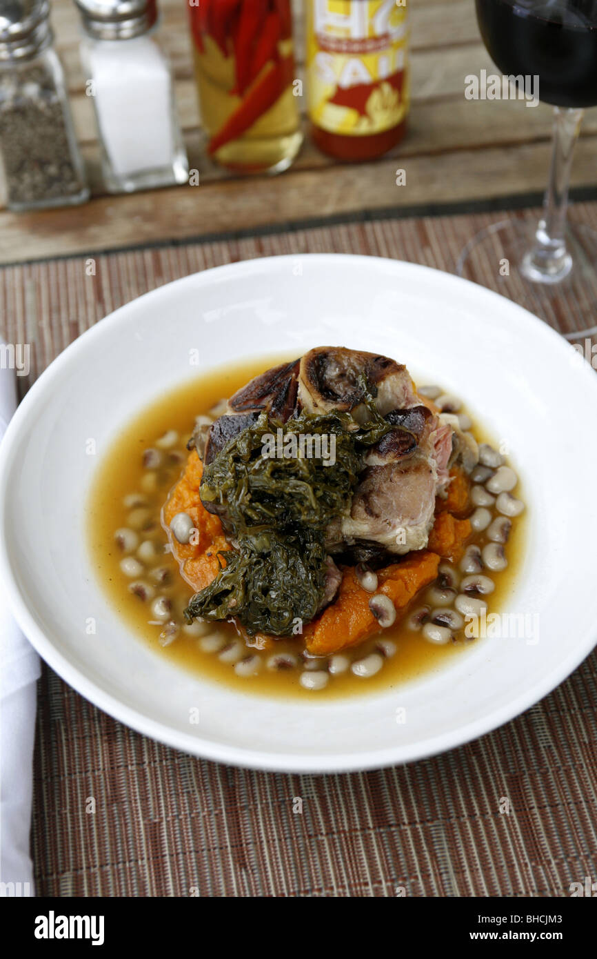 Cajun Cuisine, Ham Hock with Sweet Potatoes, Pickled Greens & Black Eye Pea Ham Broth, Cochon Restaurant, New Orleans, Louisiana Stock Photo