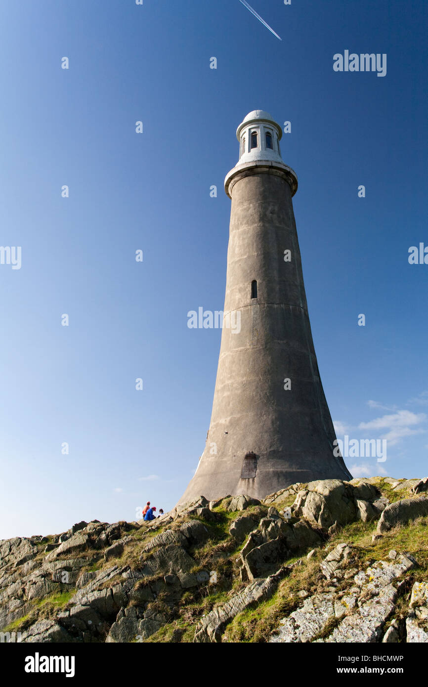Overlooking the town of Ulverston, England is the dramatic limestone lighthouse facsimile built in honour of Sir John Barrow Stock Photo